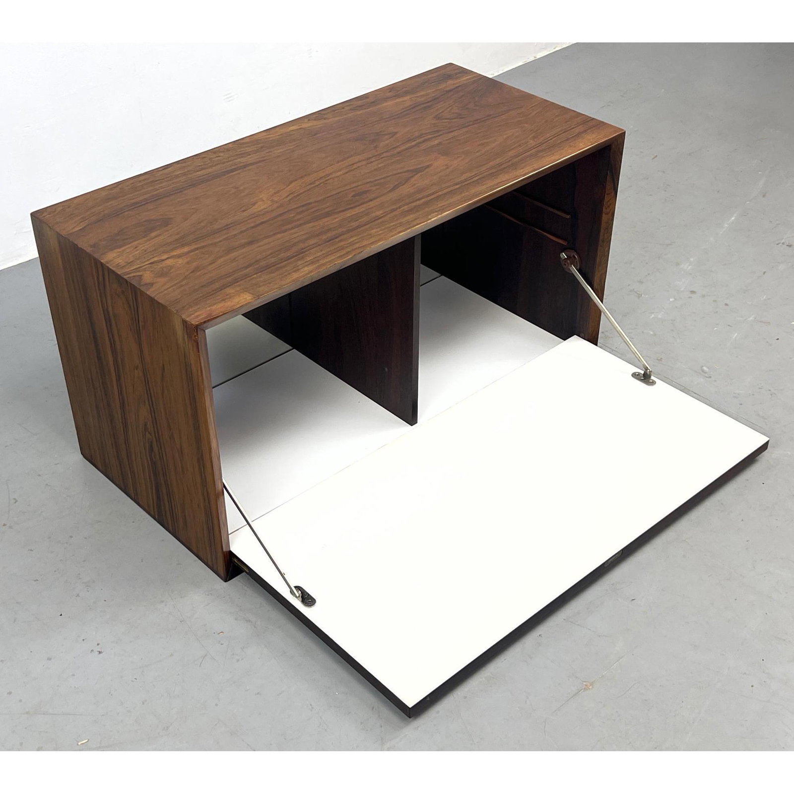 Cado rosewood bar cabinet Section. Pegs cut.: Cado rosewood bar cabinet Section. Pegs cut. Dimensions: H: 16.5 inches: W: 31.5 inches: D: 15.5 inches --- -- We offer curbside delivery to NYC, Manhattan, Close Brooklyn, Hoboken about a week after 