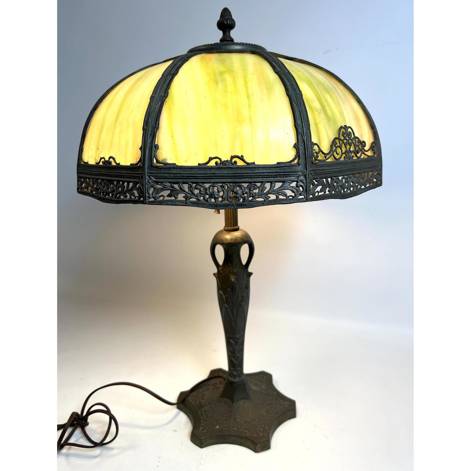 Antique green slag glass lamp with bronze or brass base.: Antique green slag glass lamp with bronze or brass base. Dimensions: H: 23 inches: W: 14 inches: D: 14 inches ---
