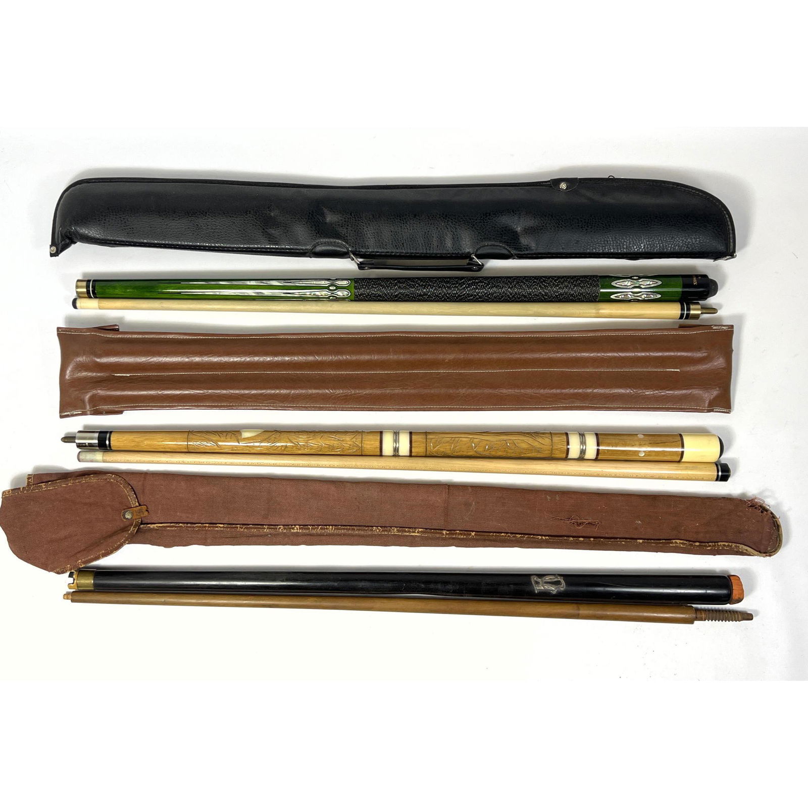 Collection of Three Pool Cues in Carry Bags.: Collection of Three Pool Cues in Carry Bags. --- US Shipping charge: In house shipping available. Will be calculated once destination known. Plus insurance at a rate of $1 per hundred.