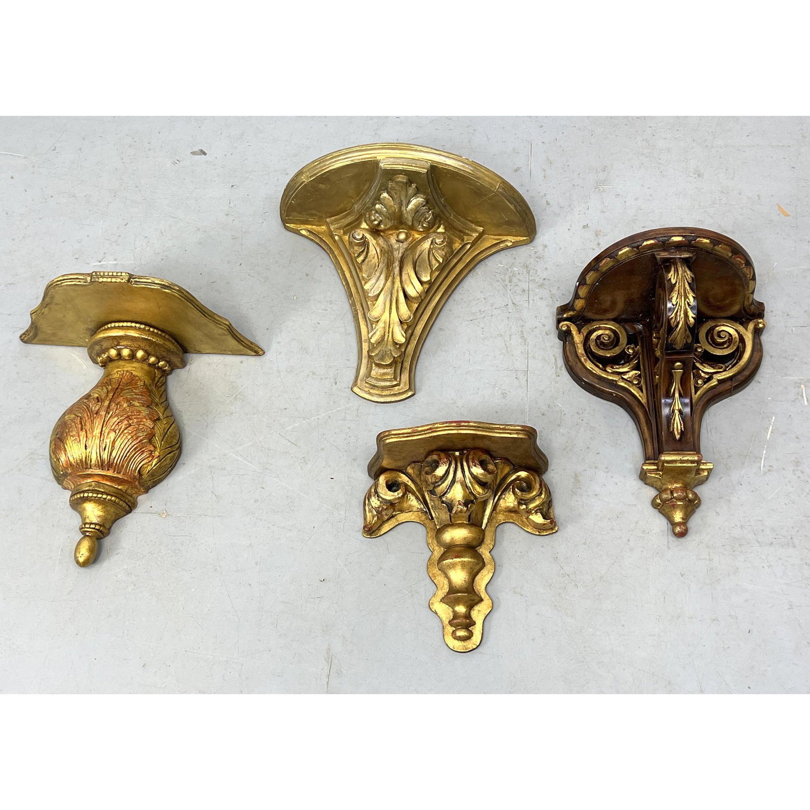 4pc Carved Wall Brackets. Most gold painted or with gold paint trim. All are wood.: 4pc Carved Wall Brackets. Most gold painted or with gold paint trim. All are wood. Dimensions: H: 16 inches: W: 19.5 inches: D: 9 inches --- US Shipping charge: In house shipping available. Will be ca