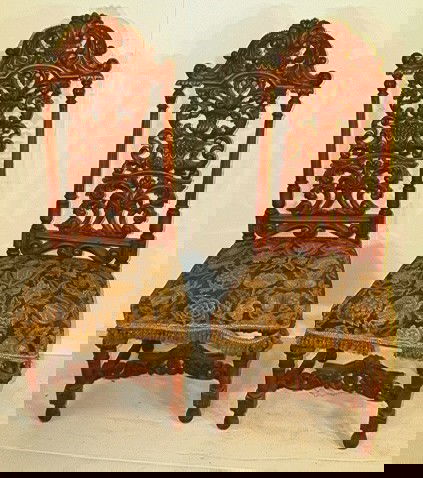 2 Antique High back carved Walnut chairs with nee: 2 Antique High back carved Walnut chairs with needlepoint seats. Heavily carved. Dimensions: H: 51 inches: W: 21 inches: D: 20 inches Condition: Dusty. Fringe worn and hanging loose. US Shipping charg