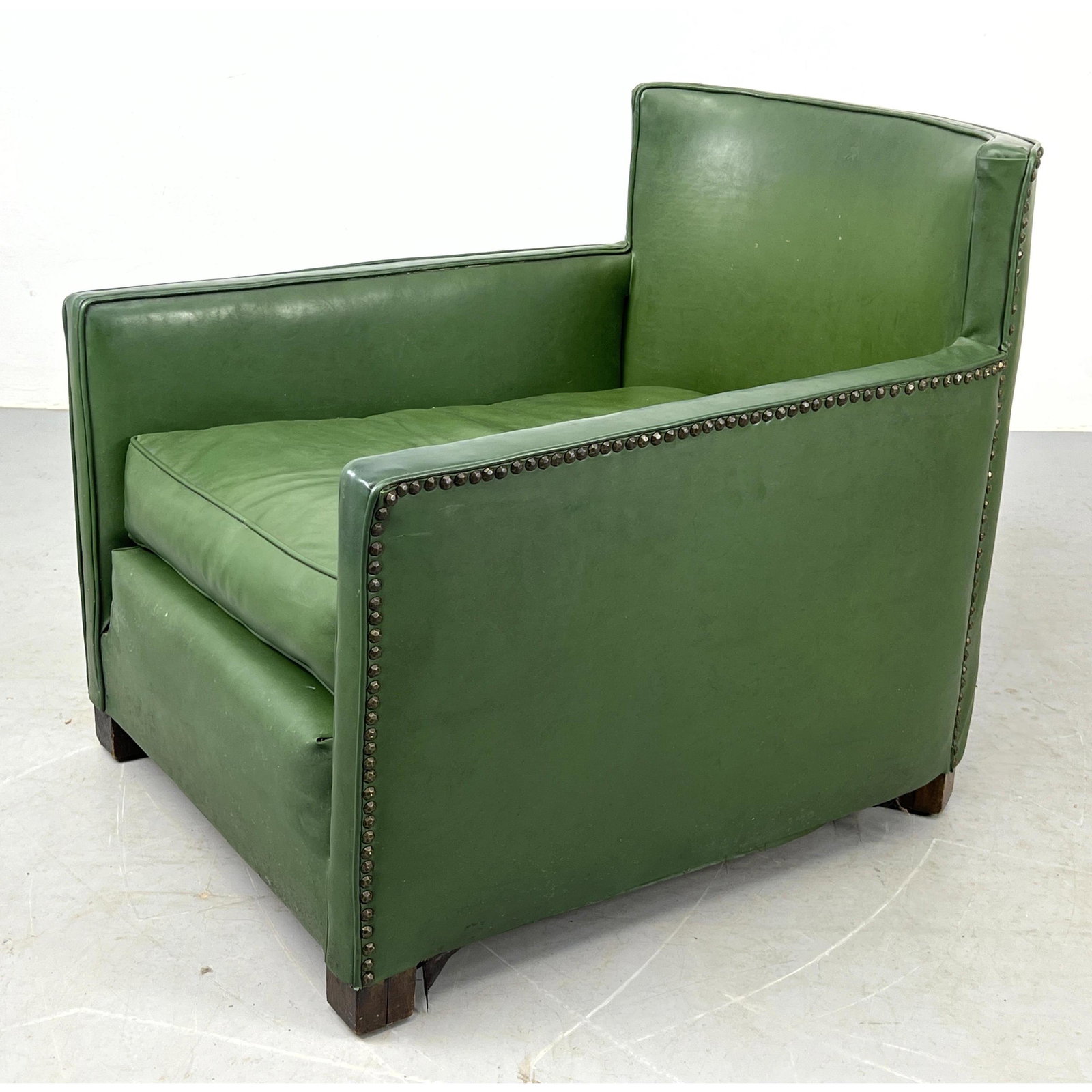 Art Deco low long lounge chair with nail head trim. Green vinyl.: Art Deco low long lounge chair with nail head trim. Green vinyl. Dimensions: H: 26 inches: W: 25 inches: D: 30 inches - Seat Height: 14 inches --- Delivery Offer: Uniques offers curbside delivery to N