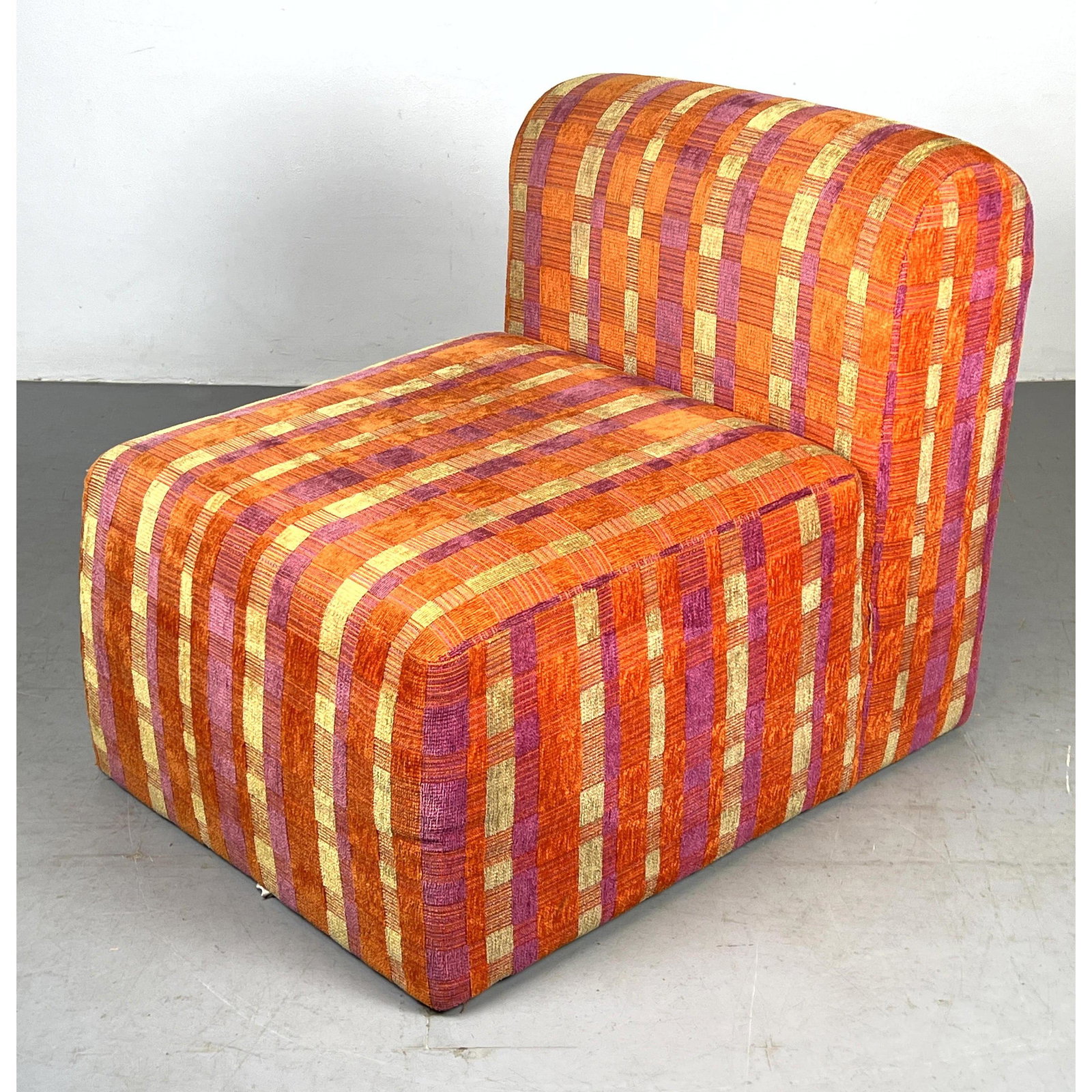 Directional funky low armless lounge chair. (1 of 9)