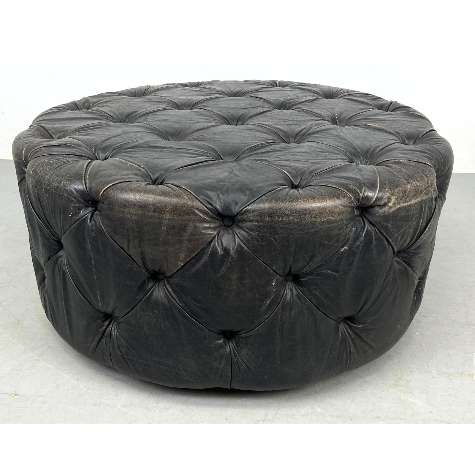 Large Tufted Leather Round Ottoman. Swivels on metal base. (1 of 7)