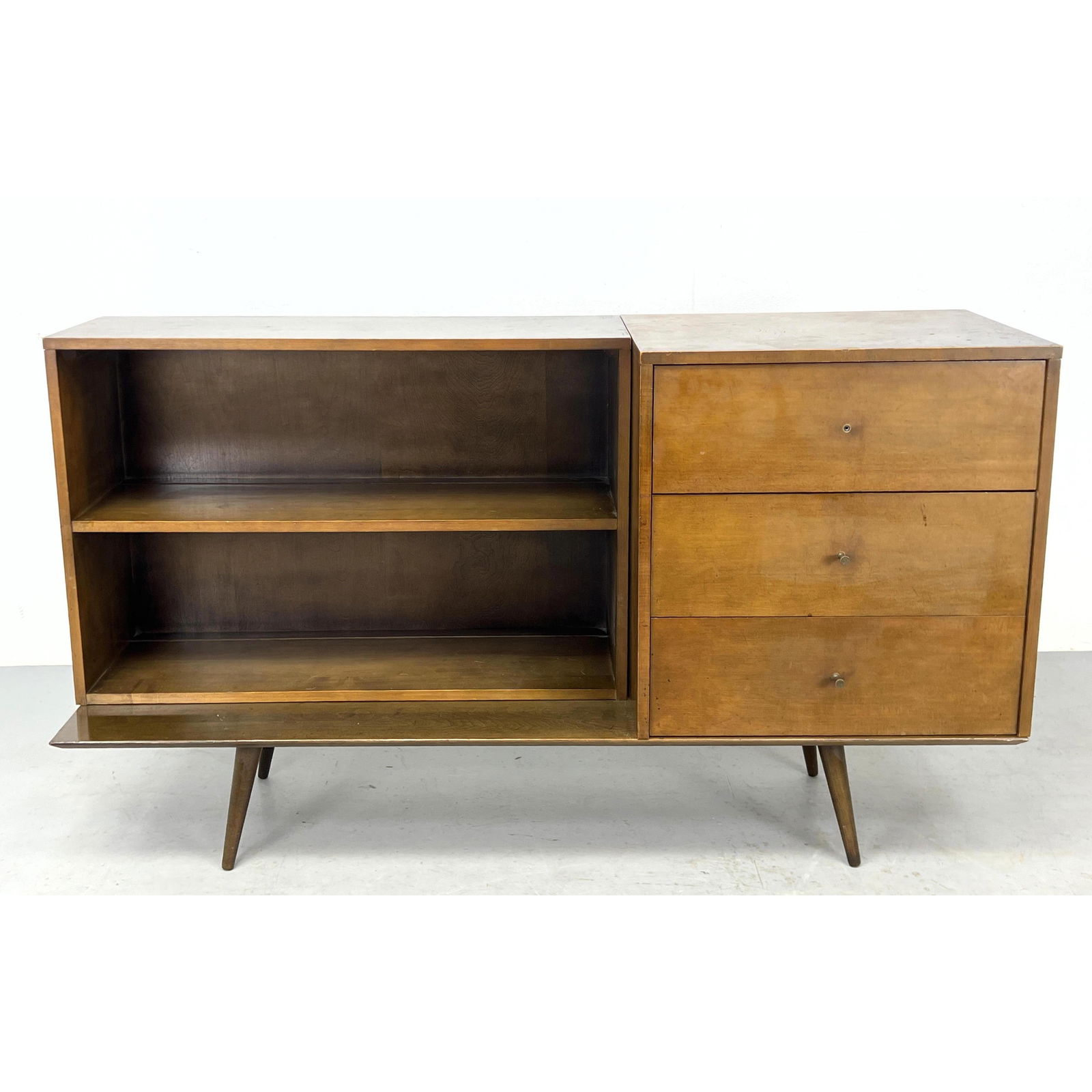 3pc PAUL McCOBB Planner Group Credenza, Low Table. Low Table with angled peg legs supports separate: 3pc PAUL McCOBB Planner Group Credenza, Low Table. Low Table with angled peg legs supports separate Cabinet with 3 drawers. Labels on inner side of drawer, back of shelving and underside of table. Dim