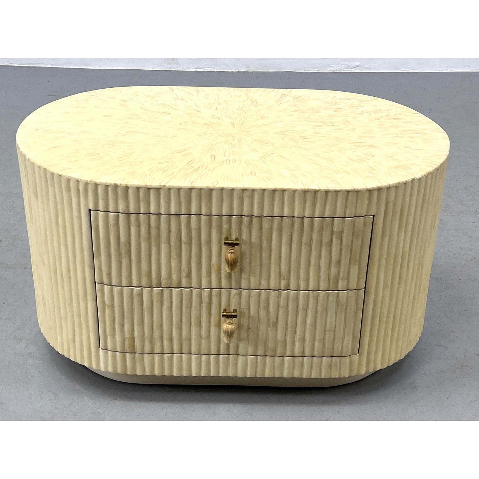 ENRIQUE GARCEL Marked Lacquered Cabinet. Oval Cabinet with Ribbed Facade. Tesselated Bone Details. T: ENRIQUE GARCEL Marked Lacquered Cabinet. Oval Cabinet with Ribbed Facade. Tesselated Bone Details. Two Lined Drawers. Label. Dimensions: H: 18.25 inches: W: 31.5 inches: D: 18.5 inches --- Delivery Of