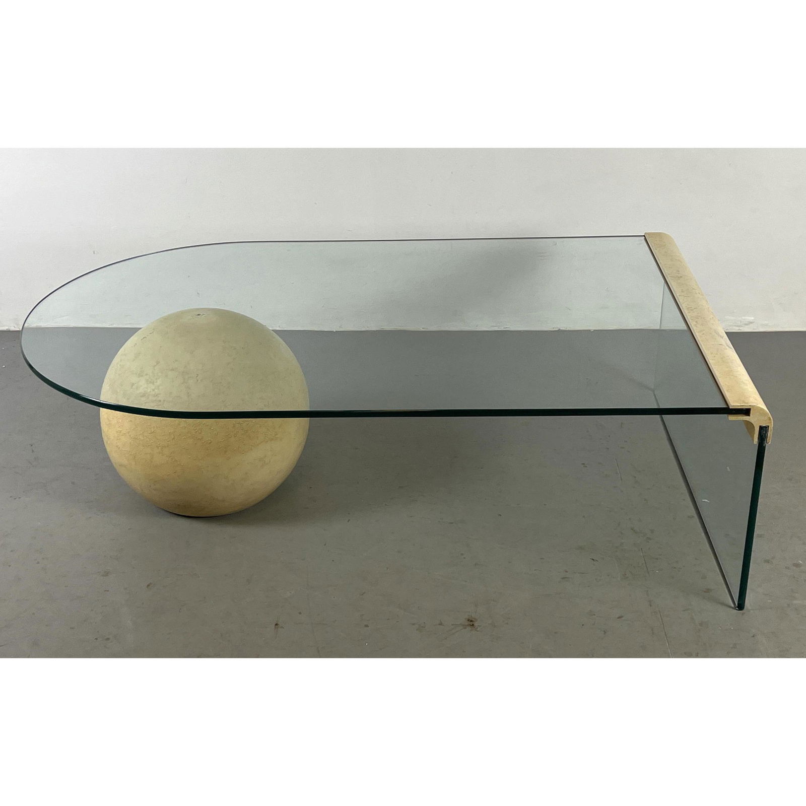 Modernist Decorator Glass Coffee Table. Single glass panel leg. Cantilever glass top rests on sphere (1 of 10)
