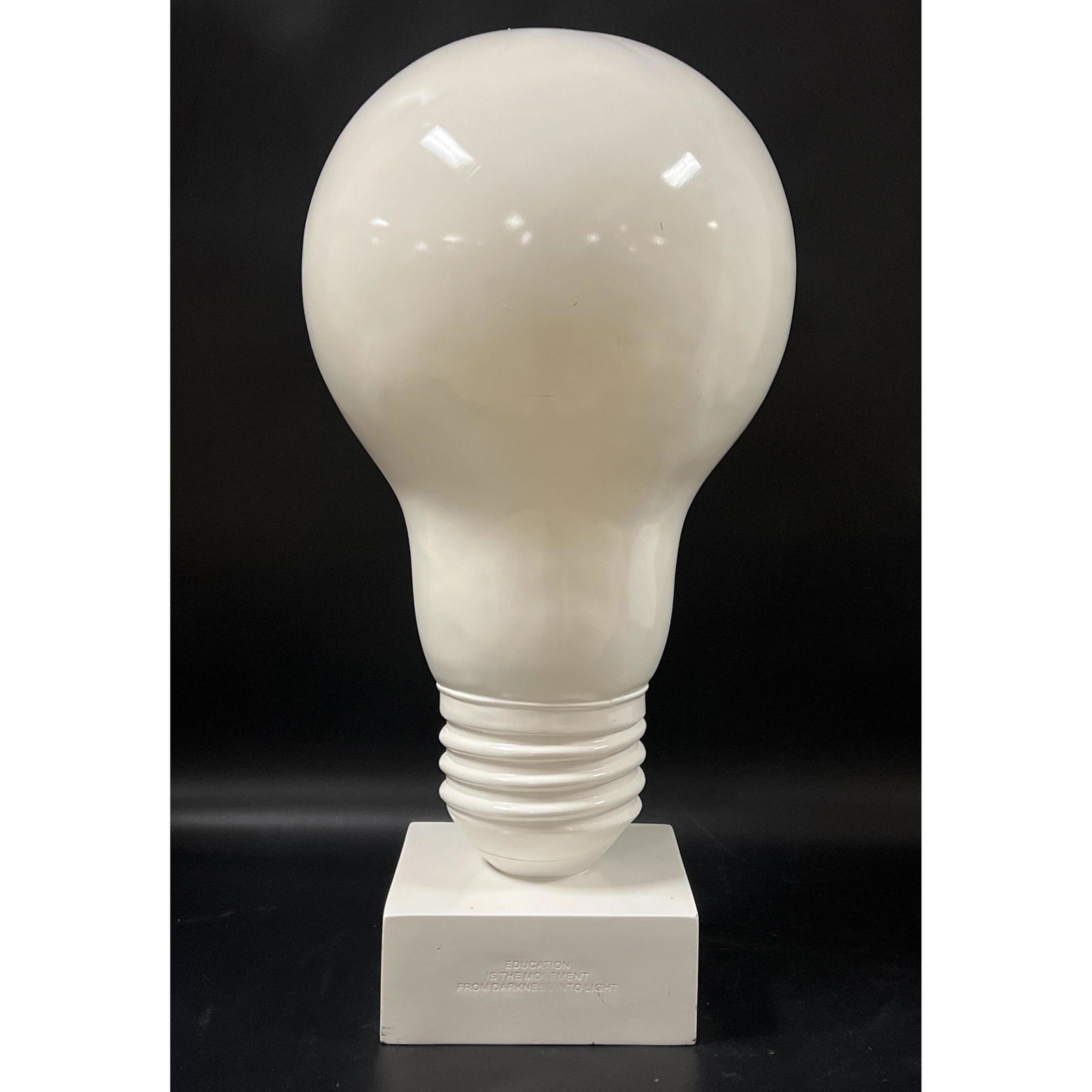 TMS Inc Modernist Light Bulb Sculpture. Quote on base: "Education is the Moment from Darkness into L (1 of 9)