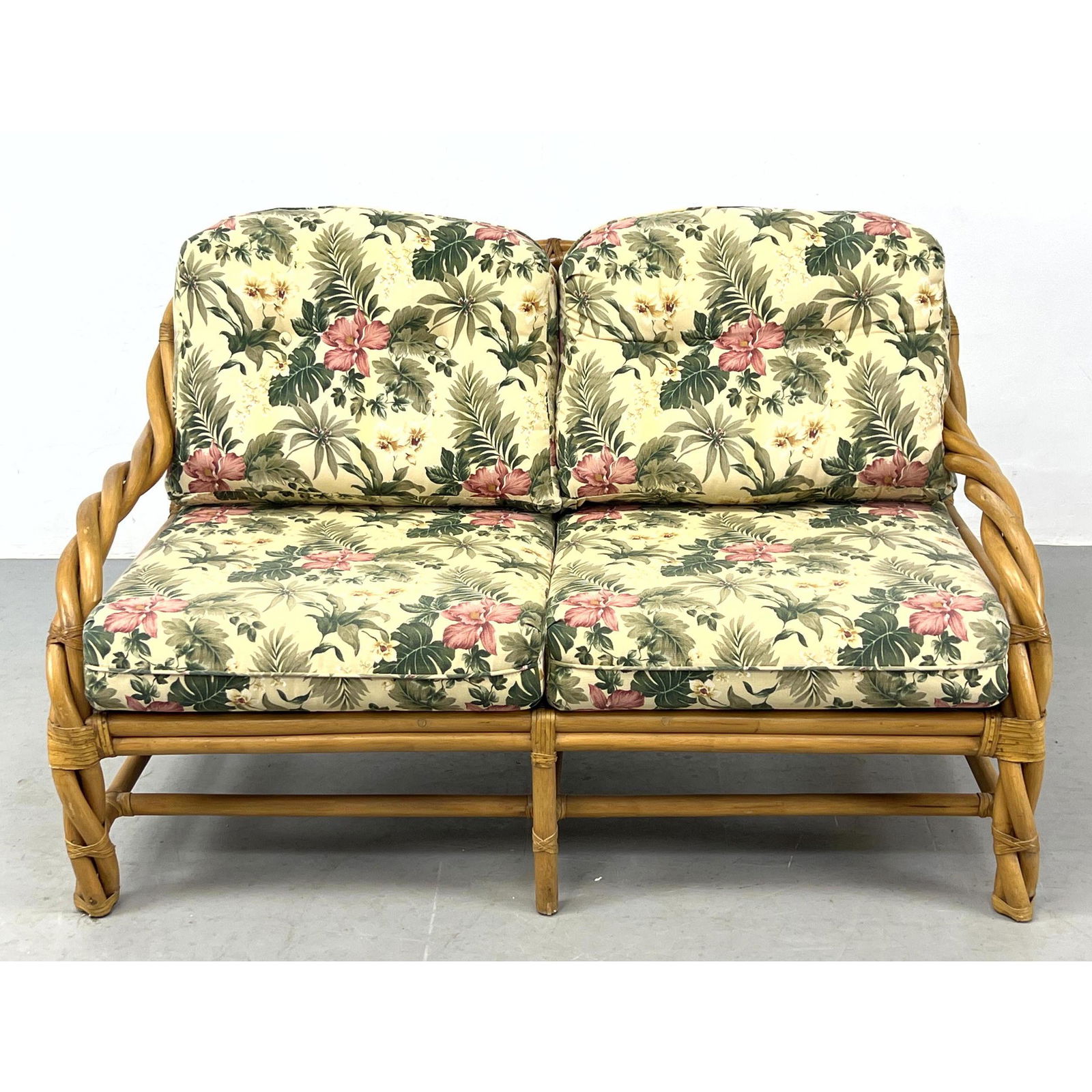 HENRY LINK Twisted Bamboo Wicker Love Seat. Tropical Floral Upholstery. Wicker by Henry Link Label. (1 of 11)