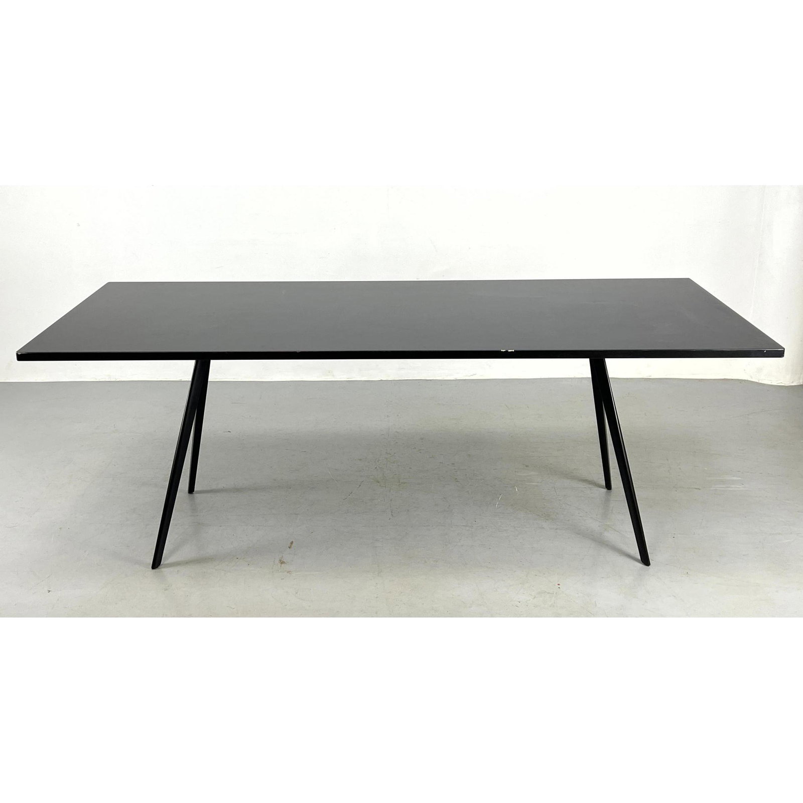 Modernist Dining Table. Lacquered Black Finish. Elegant Tapered Legs.: Modernist Dining Table. Lacquered Black Finish. Elegant Tapered Legs. Dimensions: H: 29.25 inches: W: 80.75 inches: D: 33.5 inches --- Delivery Offer: Uniques offers curbside delivery to NYC, Manhatta