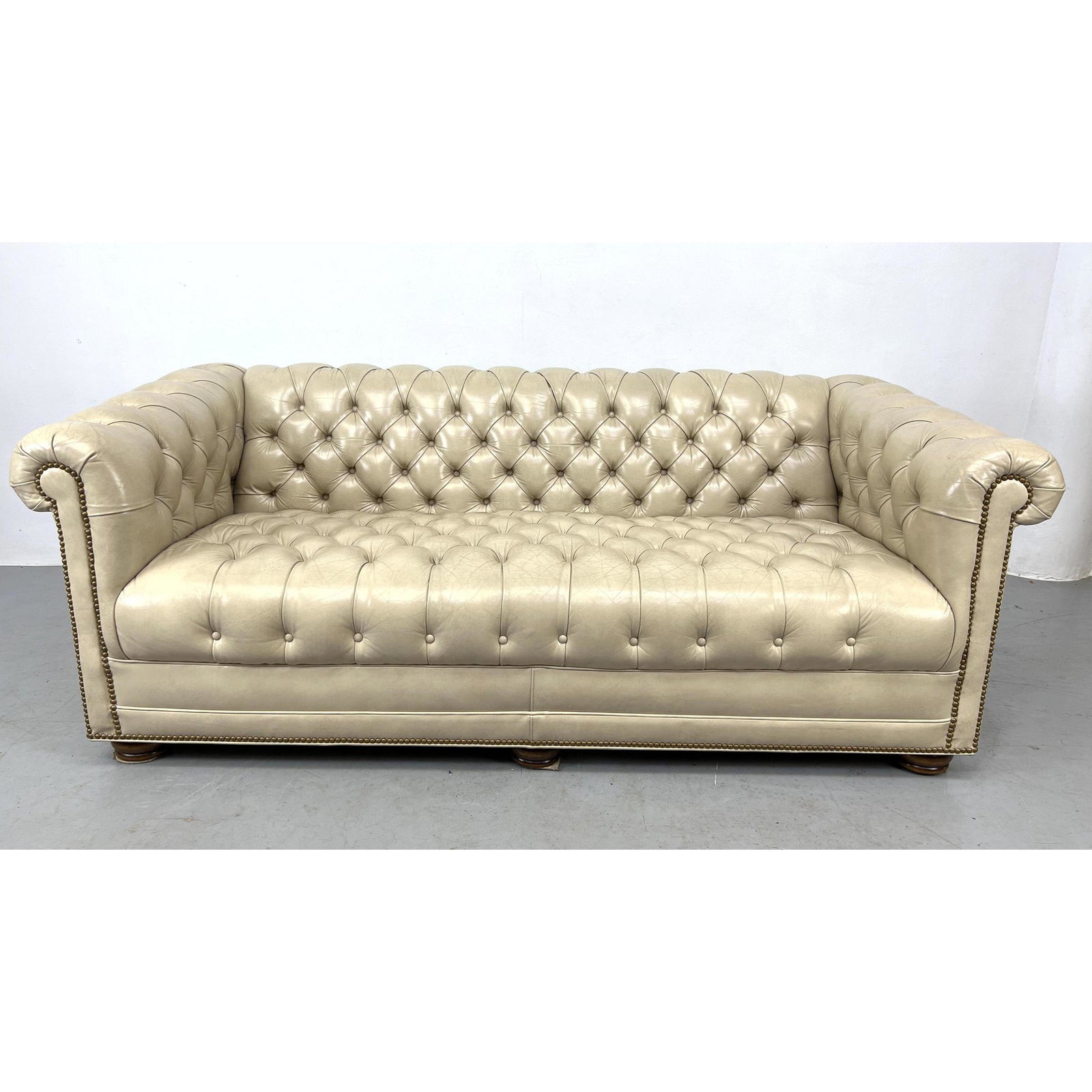 LEATHERCRAFT Beige Leather Chesterfield Sofa Couch. Brass Stud Trim. Wood feet. Label. (1 of 10)