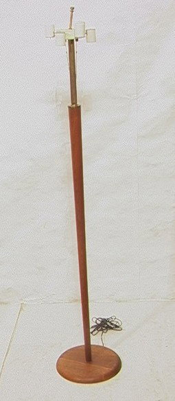 PHIL POWELL Walnut Floor Lamp. Tapered Walnut ste: PHIL POWELL Walnut Floor Lamp. Tapered Walnut stem. 6 bulb lamp. Tag: IMF, dated 2/4/70. -- Dimensions: H: 64 inches: W: 12 inches