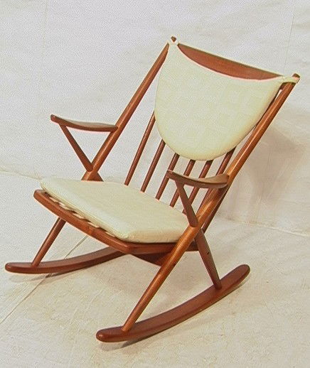 FRANK REENSKAUG Spindle Back Danish Teak Rocker.: FRANK REENSKAUG Spindle Back Danish Teak Rocker. BRAMIN rocking chair. HANS WEGNER style. Cushion seat and back rest. Label.-- Dimensions: H: 35 inches: W: 26 inches: D: 33 inches