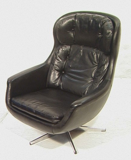 OVERMAN style Tall Back Rocking Swivel Chair. Tuf: OVERMAN style Tall Back Rocking Swivel Chair. Tufted black vinyl. Unmarked.-- Dimensions: H: 38 inches: W: 33 inches: D: 32 inches ---