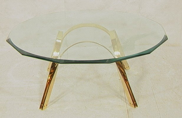 CARL SPRINGER for DUNBAR Cocktail Table. Arched F: CARL SPRINGER for DUNBAR Cocktail Table. Arched Flat Tube Brass Base. 3/4" thick beveled glass shaped top.-- Dimensions: H: 18 inches: W: 46 inches ---