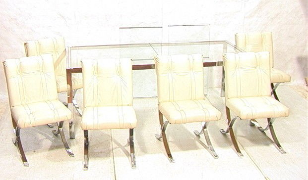 70's Modern Chrome and Glass Dining Set. 6 chair: 70's Modern Chrome and Glass Dining Set. 6 chairs with white vinyl and chrome x base. Large inset glass table. 2 leaves.-- Dimensions: ---