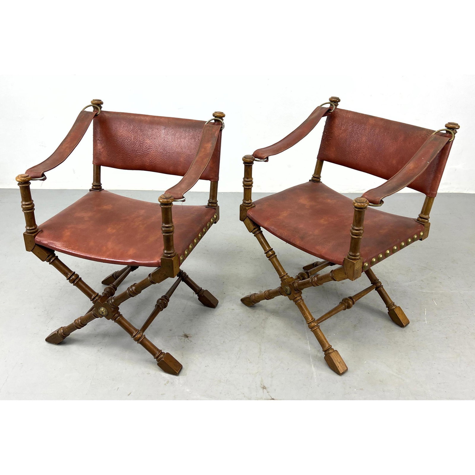 Pair of Drexel Wood Frame Campaign Style Arm Chairs. Brown Vinyl Sling Seats and Arms.: Pair of Drexel Wood Frame Campaign Style Arm Chairs. Brown Vinyl Sling Seats and Arms. Dimensions: H: 33 inches: W: 24 inches: D: 20 inches - Seat Height: 18.5 inches ---