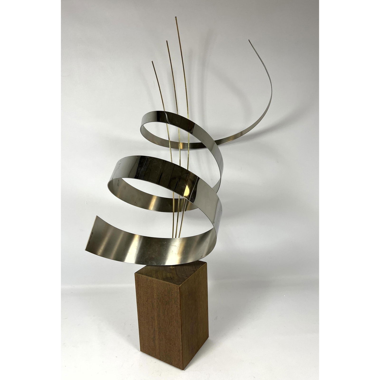 Curtis Jere Metal Sculpture on Custom Solid Teak Block Base. Signed C. JERE 1992: Curtis Jere Metal Sculpture on Custom Solid Teak Block Base. Signed C. JERE 1992 Dimensions: H: 34 inches: W: 11 inches: D: 19 inches ---