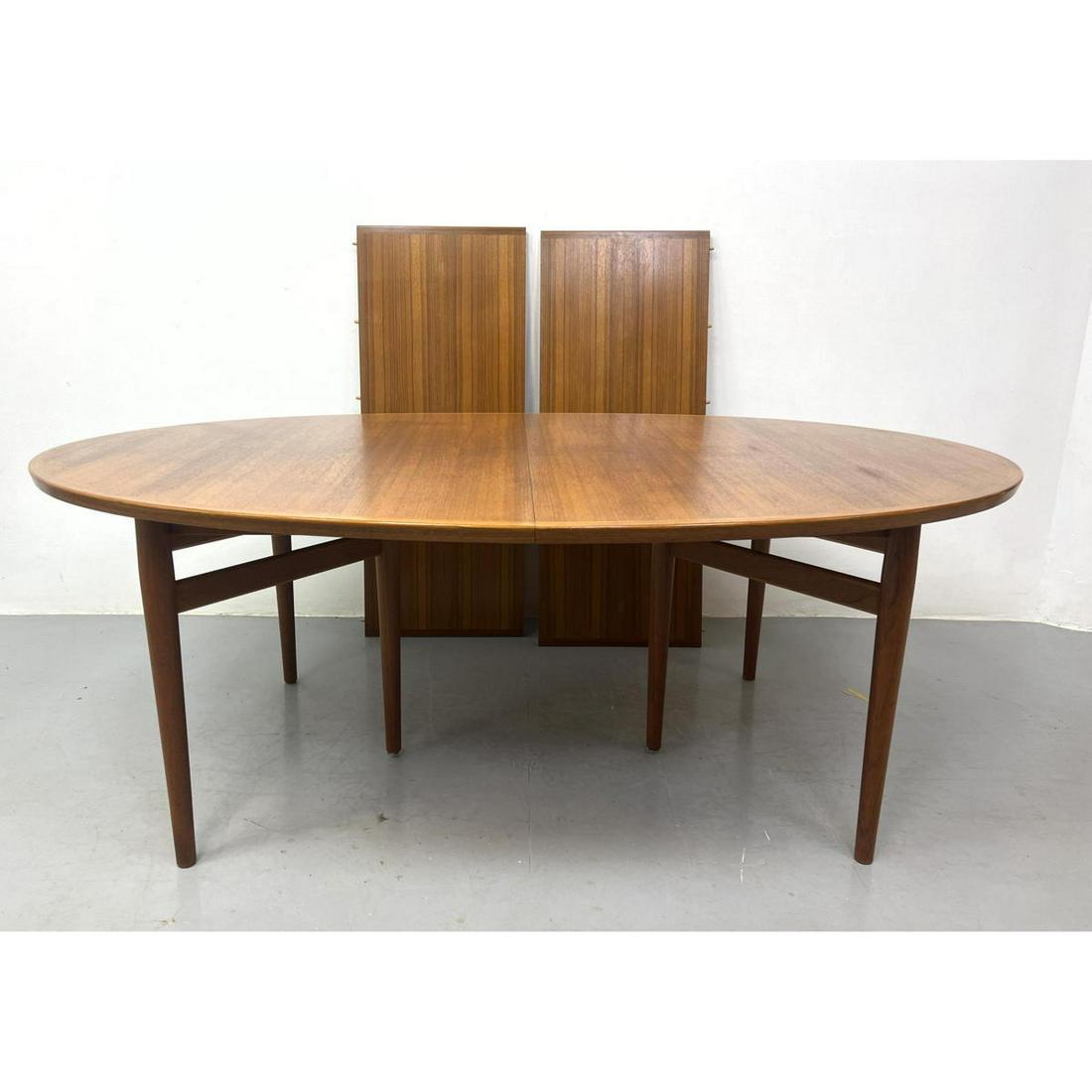 ARNE VODDER Teak Danish Modern Dining Table. Oval Form.: ARNE VODDER Teak Danish Modern Dining Table. Oval Form. Includes: 2 - 19.5 inch leaves Dimensions: H: 28.5 inches: W: 79 inches: D: 49 inches ---