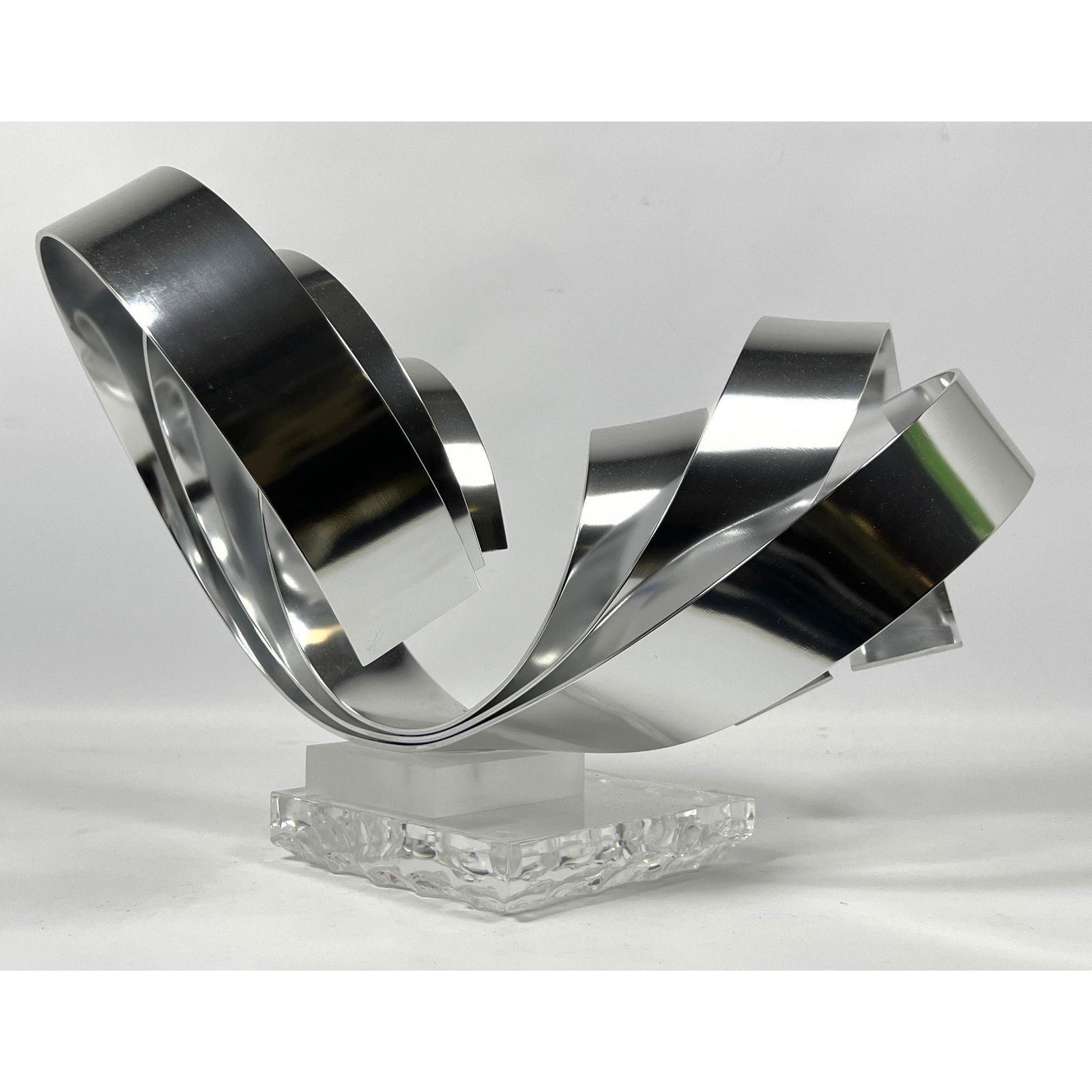 Dan Murphy 1997 Ribbon Sculpture  with clear square sculpted acrylic base.  Signed and numbered 38/8 (1 of 7)