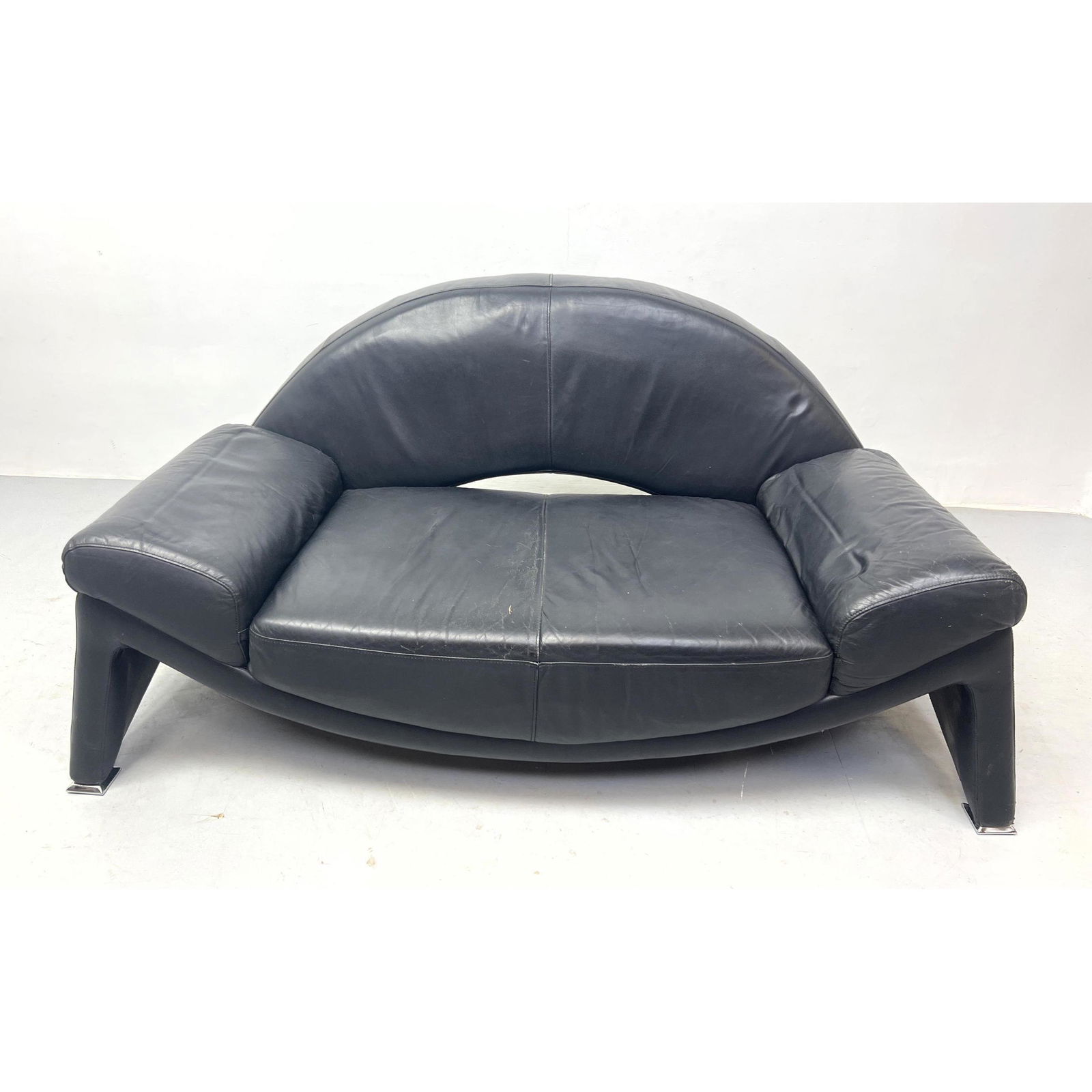 Modernist Black Leather Love Seat. Arched Open Back. Padded Arms. (1 of 8)