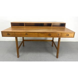 Peter Lovig Nielsen Flip-Top Teak Desk often attributed to Jens Quistgaard. Marked on Base.  Dansk: Peter Lovig Nielsen Flip-Top Teak Desk often attributed to Jens Quistgaard. Marked on Base. Dansk Dimensions: H: 34 inches: W: 63.5 inches: D: 29 inches --- We offer curbside delivery to NYC, Manhatta