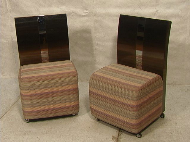 PR PAUL EVANS style Stainless Side Chairs. Brushe: PR PAUL EVANS style Stainless Side Chairs. Brushed and polished steel backs. Flared top. Upholstered seats on casters. Unmarked. 2 PCS-- Dimensions: H: 38 inches: W: 22.5 inches: D: 22 inches ---