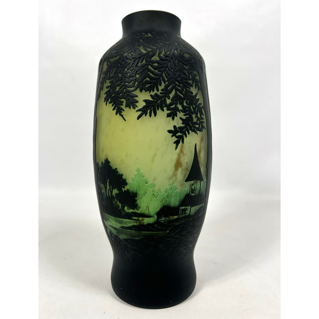 After Galle Carved Cameo Glass Vase. Bridge and Building elements in carved landscape design. Bears: After Galle Carved Cameo Glass Vase. Bridge and Building elements in carved landscape design. Bears questionable signature. Dimensions: H: 10.5 inches: W: 5 inches: D: 5 inches --- US Packing and Ship