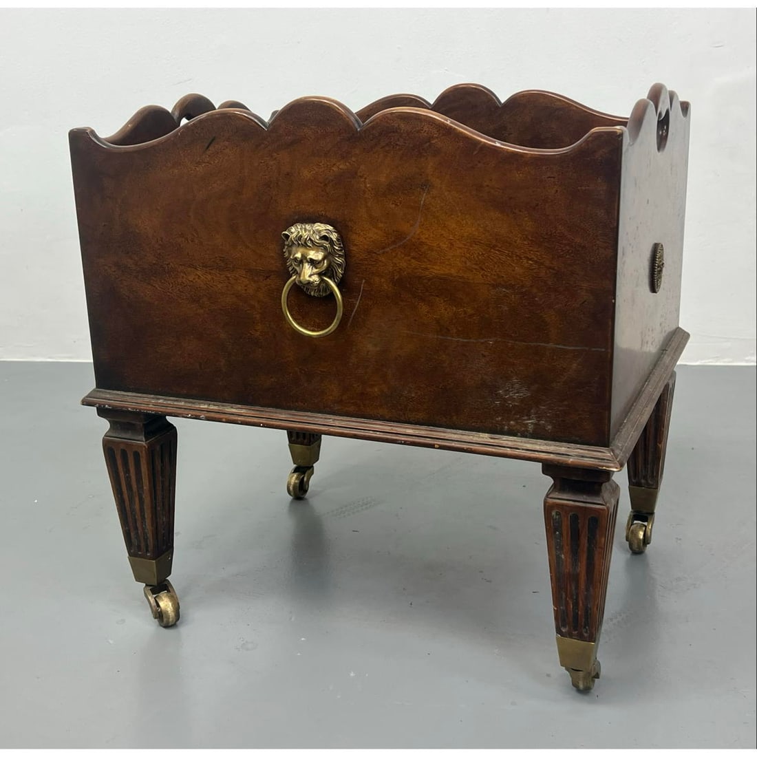 Classic style Magazine Rack. Curved shape rims. Square tapered fluted legs with brass casters. Brass (1 of 15)