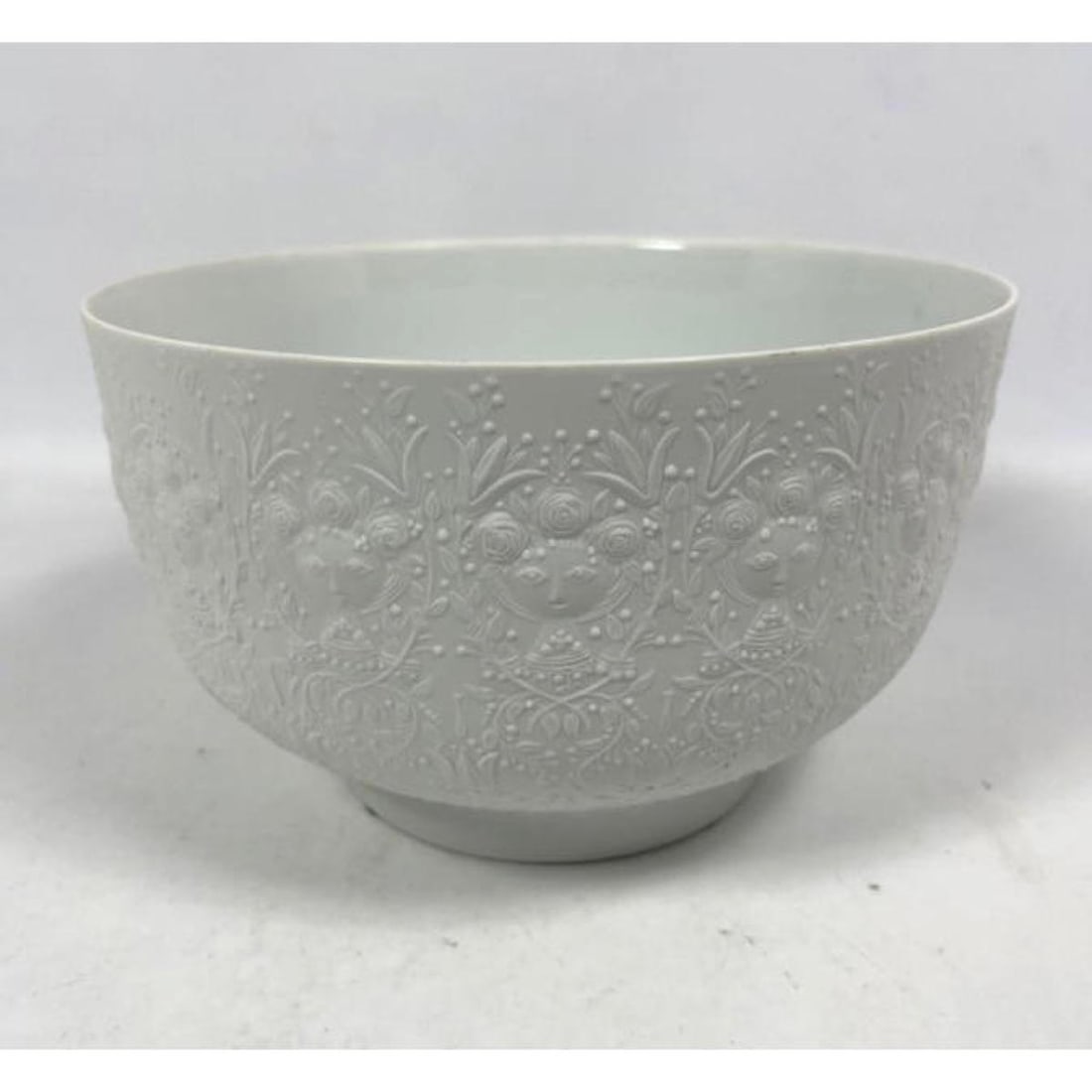 BJORN WIINBLAD For ROSENTHAL Porcelain Bowl. Relief tone on tone face and floral design. Marked.: BJORN WIINBLAD For ROSENTHAL Porcelain Bowl. Relief tone on tone face and floral design. Marked. H: 5.75 inches: W: 9.5 inches: D: 9.5 inches --- US Packing and Shipping charge: In house shipping avai
