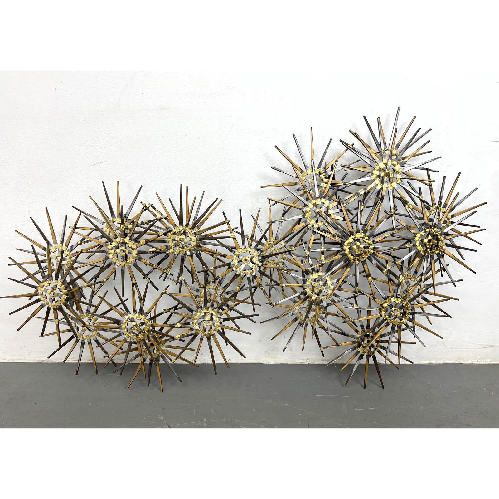 Marc Creates Large Starburst Brutalist Wall Sculpture. Welded Square Nails. Label.: Marc Creates Large Starburst Brutalist Wall Sculpture. Welded Square Nails. Label. H: 22 inches: W: 45.5 inches: D: 5.5 inches ---