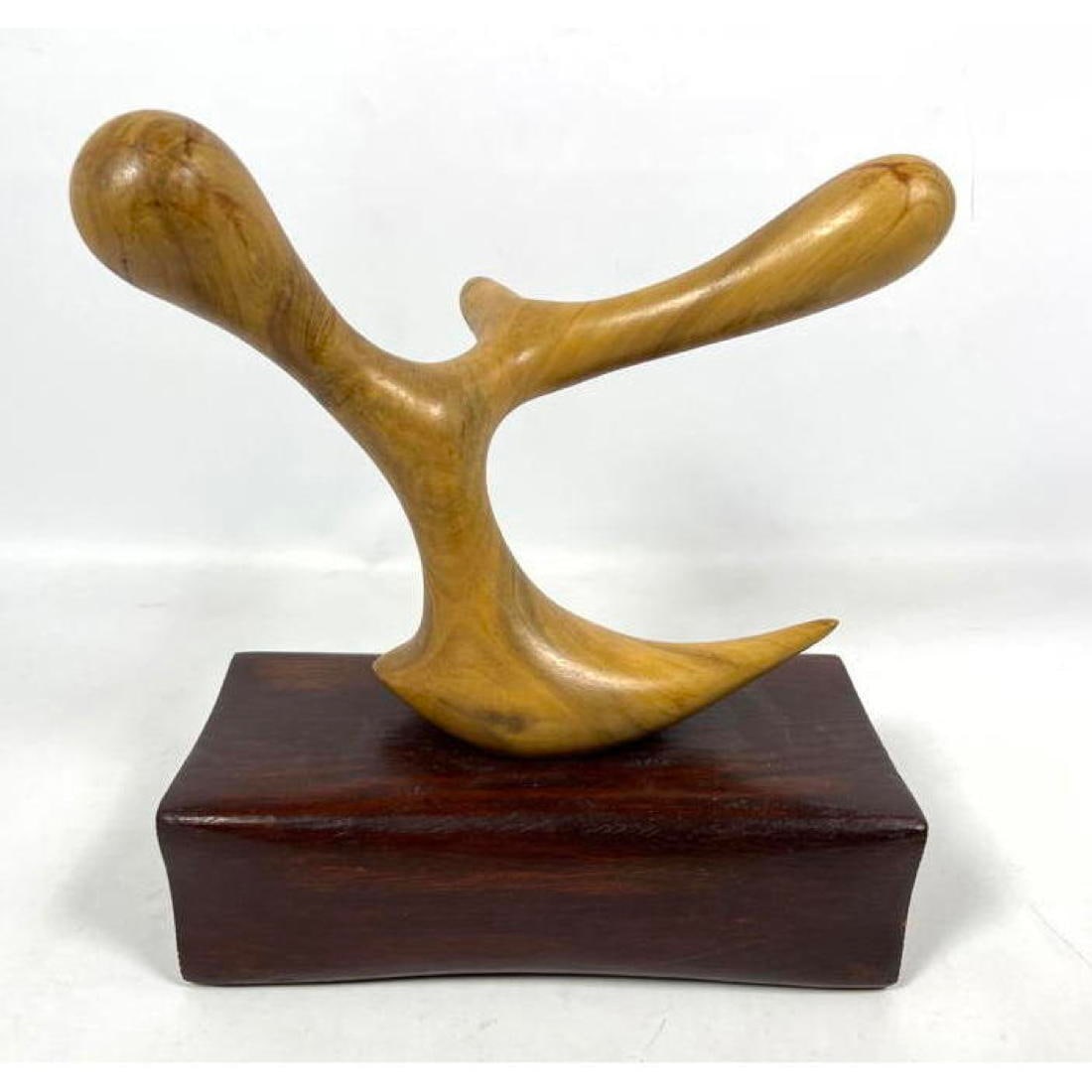 Modernist Abstract Wood Sculpture. Blond wood organic form on dark wood base. "Take up the Reel".: Modernist Abstract Wood Sculpture. Blond wood organic form on dark wood base. "Take up the Reel". H: 13.5 inches: W: 12 inches: D: 5 inches ---