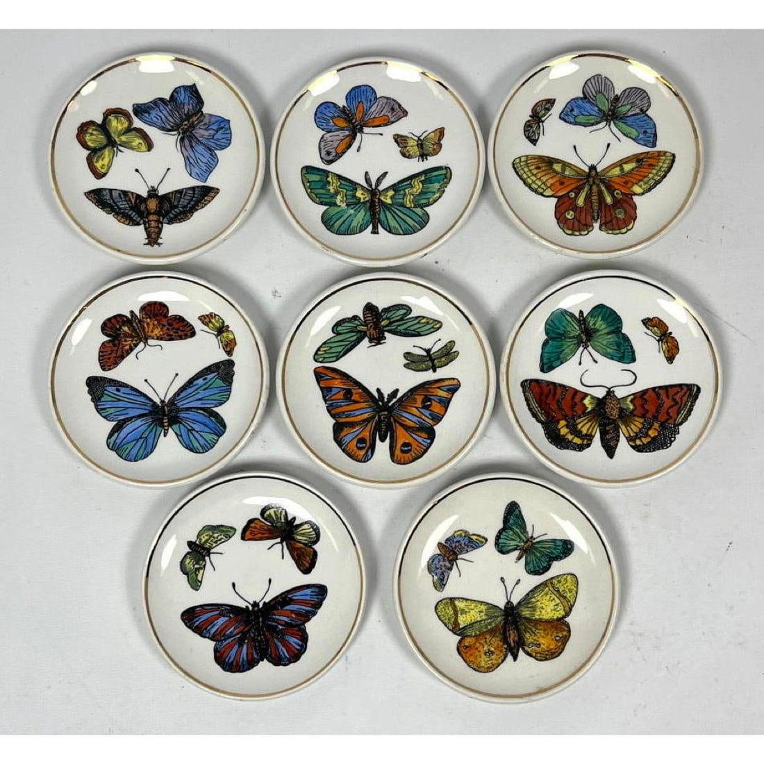 Set Italian Piero Fornasetti style Butterfly Coasters. Colorful graphic images of butterflies. Marke: Set Italian Piero Fornasetti style Butterfly Coasters. Colorful graphic images of butterflies. Marked Italy. : W: 4 inches: D: 4 inches --- US Packing and Shipping charge: $35 Plus insurance at a rate