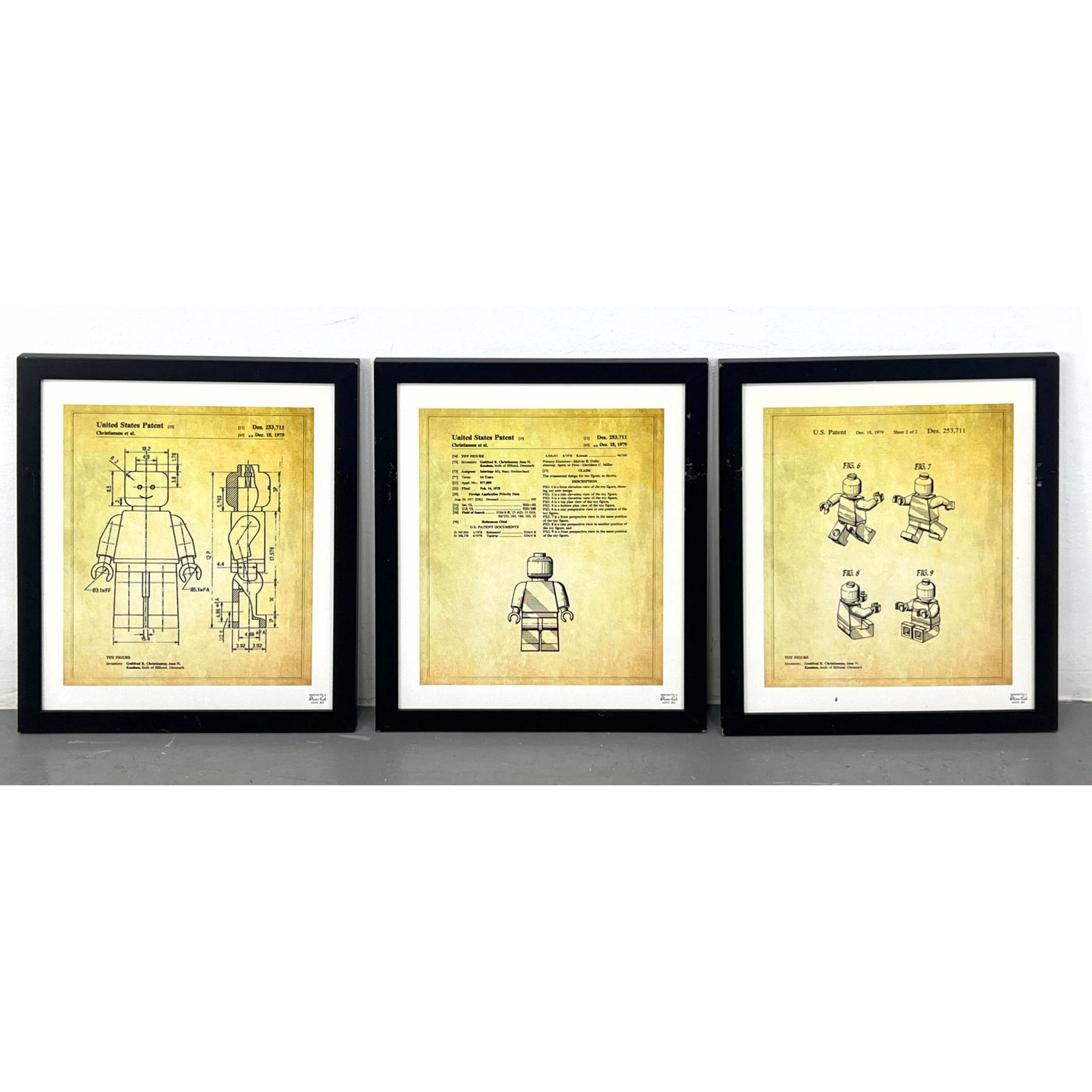 Set 3 Oliver Gal Lego Figure Patent Art. Framed under glass.: Set 3 Oliver Gal Lego Figure Art. Framed under glass. Dimensions: Image Size: H: 15 inches: W: 12.25 inches: Frame Height: 20 inches: Frame Width: 17 inches --- US Packing and Shipping charge: In hous
