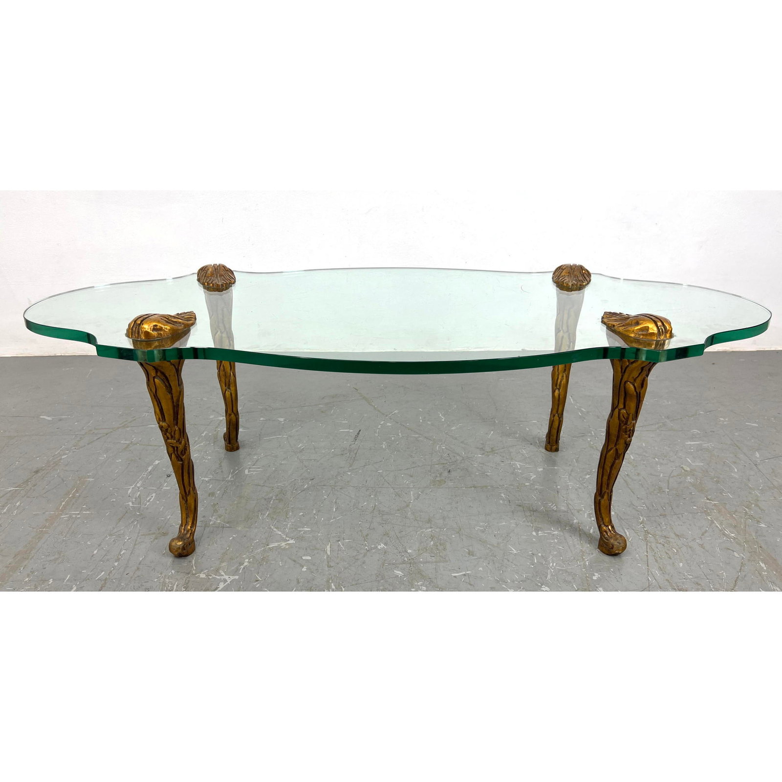 Gilt Carved Wood Fancy Cabriole Leg Glass Top Coffee Table. Thick Shaped Glass.: Gilt Carved Wood Fancy Cabriole Leg Glass Top Coffee Table. Thick Shaped Glass. H: 15.5 inches: W: 50 inches: D: 24.5 inches ---