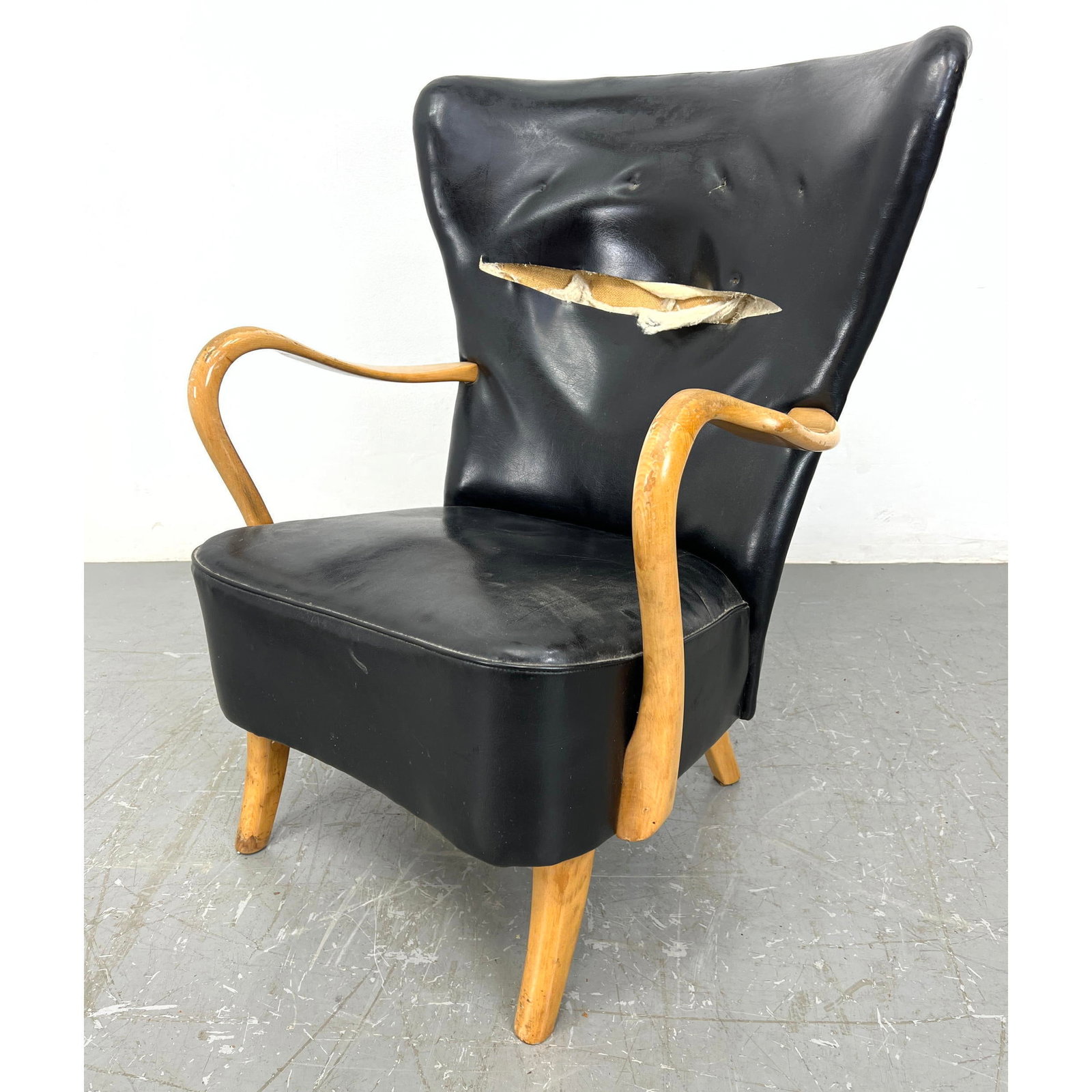 1940s Danish Lounge Chair Designed by Alfred Christensen Modern Lounge Chair.: 1940s Danish Lounge Chair Designed by Alfred Christensen Modern Lounge Chair. Black Vinyl Blond Wood Frame Modernist Wing Chair. Dimensions: H: 38 inches: W: 28.5 inches: D: 21 inches - Seat Height: 1