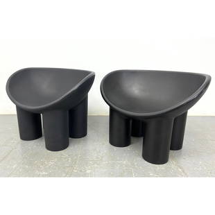 Pr Roly Poly Molded Plastic Lounge Chairs. Black seat with four thick column legs. Faye Toogood Roly: Pr Roly Poly Molded Plastic Lounge Chairs. Black seat with four thick column legs. Faye Toogood Roly Unmarked. Dimensions: H: 24 inches: W: 33 inches: D: 22 inches - Seat Height: 15 inches ---