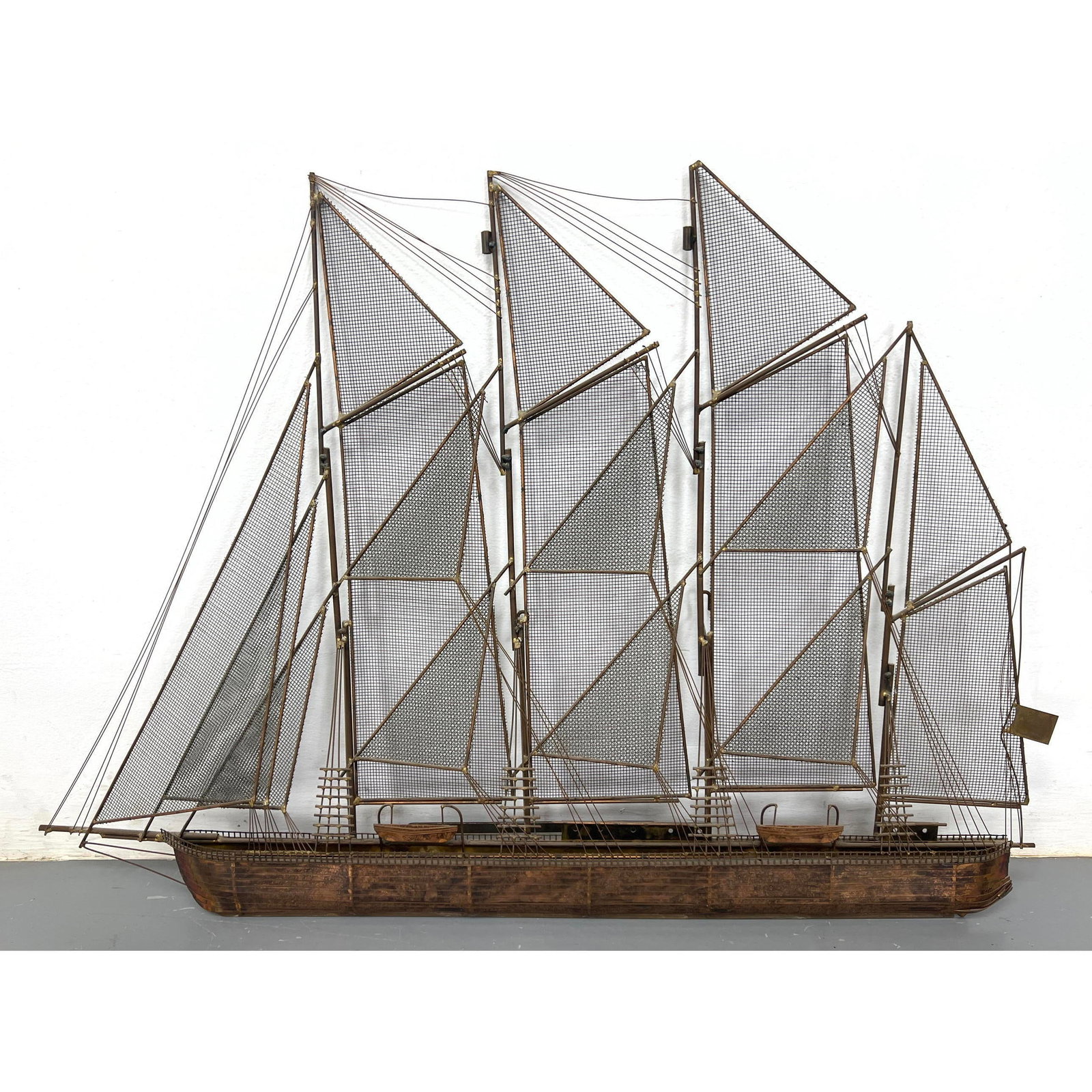 C JERE Mixed Metal Sailboat Sculpture. Copper Hull, Brass with Rigging and Metal Screen Sails. Wall: C JERE Mixed Metal Sailboat Sculpture. Copper Hull, Brass with Rigging and Metal Screen Sails. Wall Sculpture. Beach Shore House. Signed. Dimensions: H: 30 inches: W: 42 inches: D: 4 inches ---