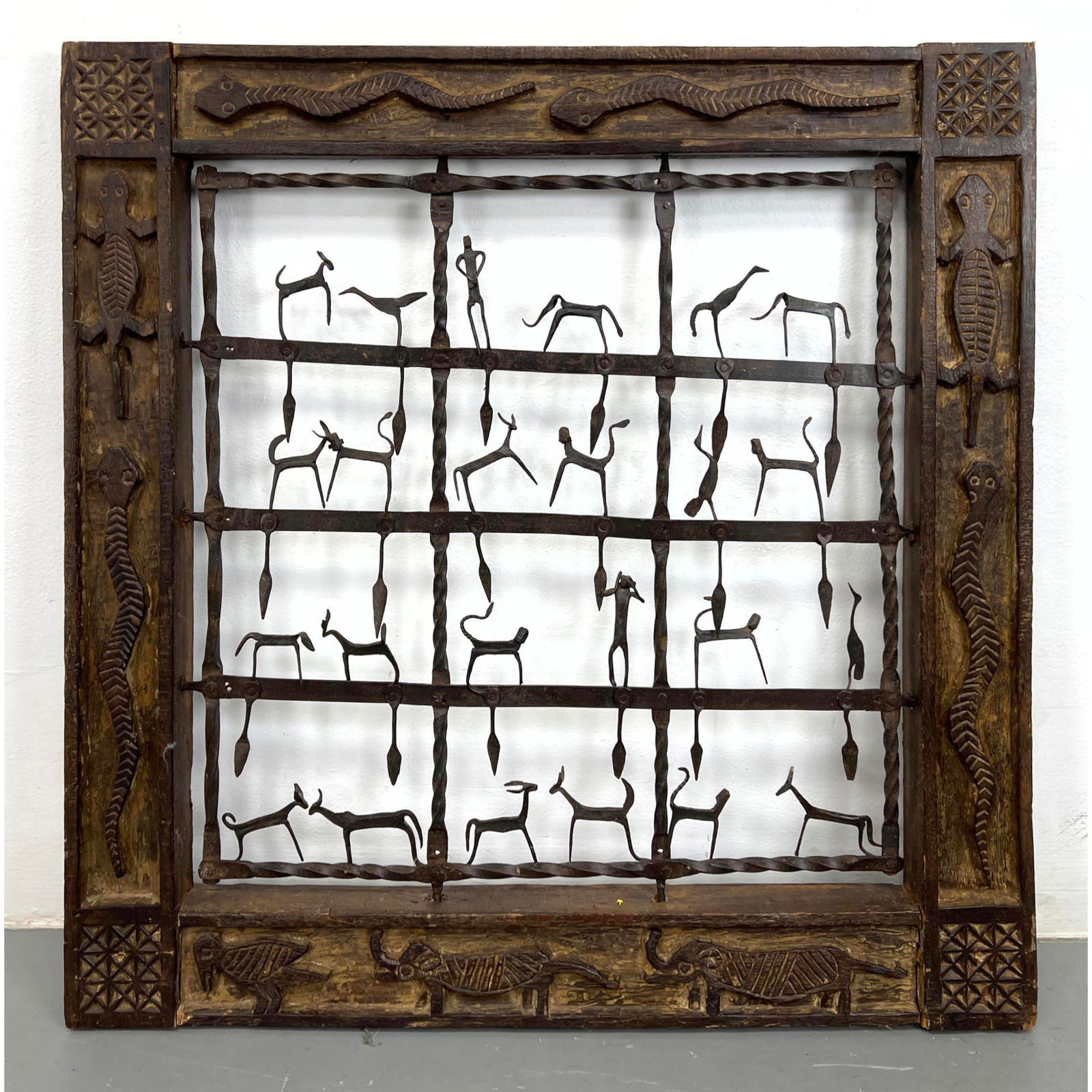 Ethnographic Panel Wall Hanging.  Carved wood frame with animal decorated iron interior. (1 of 12)
