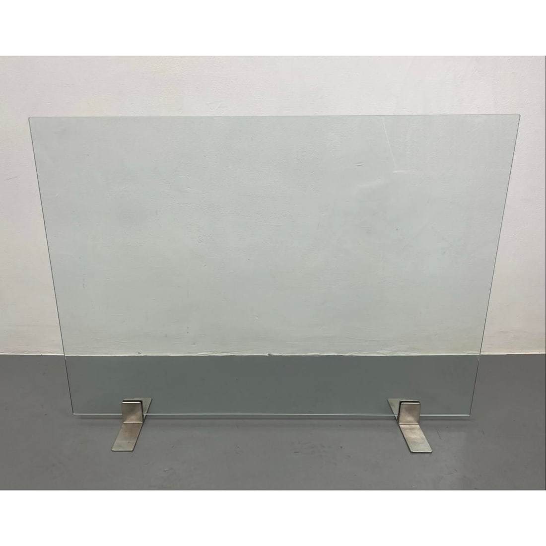 Modernist Clear Glass Fireplace Screen. Minimalist design with metal feet.: Modernist Clear Glass Fireplace Screen. Minimalist design with metal feet. Dimensions: H: 29 inches: W: 39 inches: D: 8 inches ---
