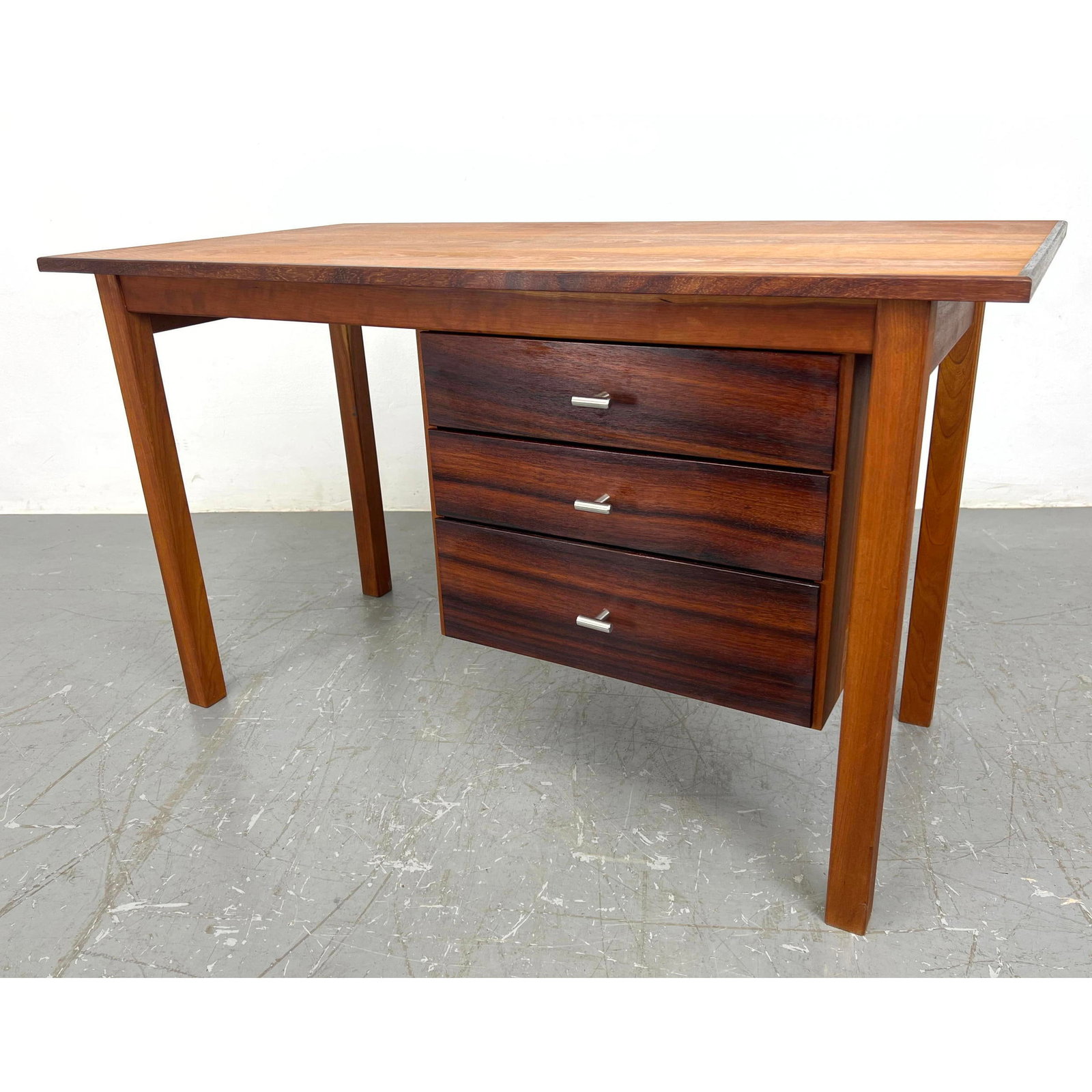 Mid Century Modern Rosewood Desk. Nicely grained drawers with stylish metal pulls.: Mid Century Modern Rosewood Desk. Nicely grained drawers with stylish metal pulls. Dimensions: H: 26.5 inches: W: 46 inches: D: 24 inches ---