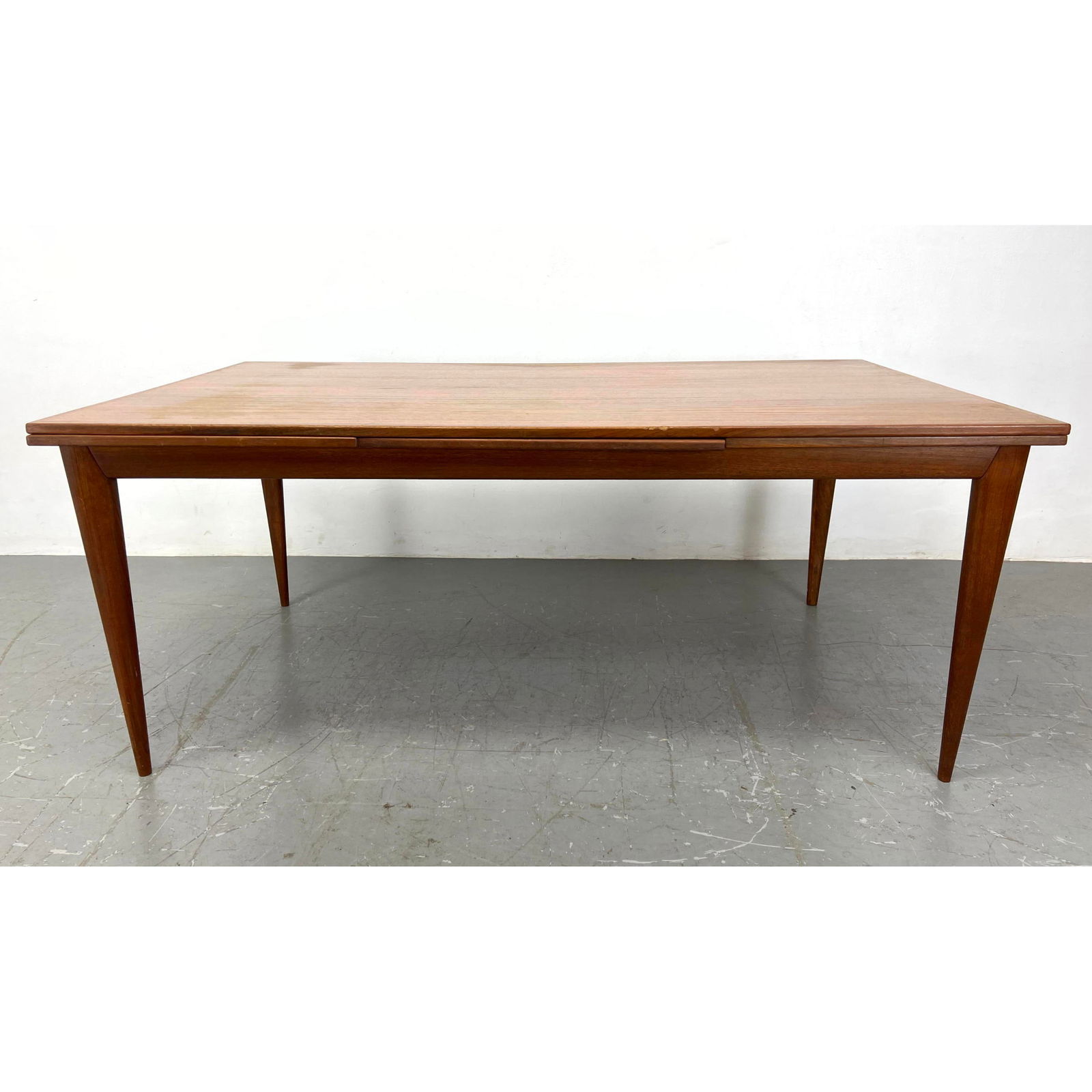 Danish Modern Teak Refractory Dining Table. Attributed to Neil Otto Moller.: Danish Modern Teak Refractory Dining Table. Attributed to Neil Otto Moller. Includes: 2 - 23 inch leaves. Dimensions: H: 29 inches: W: 71 inches: D: 41 inches ---