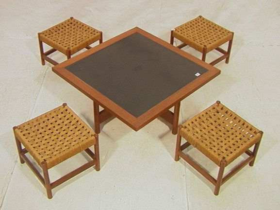 STEVENSON DAVIES Table & Four Benches. Low Square: STEVENSON DAVIES Table & Four Benches. Low Square Coffee Cocktail Table with black laminate top in wood frame. Four square rush stools nest under table top. Labeled.-- Dimensions: H: 15 inches: W: 37