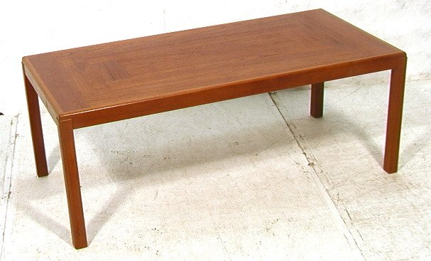 Danish Modern Teak Coffee Table by VEJLE. Rounded: Danish Modern Teak Coffee Table by VEJLE. Rounded edge top with squared wood legs. Marked Velje, Made in Denmark. -- Dimensions: H: 20 inches: W: 53 inches: D: 25.5 inches ---