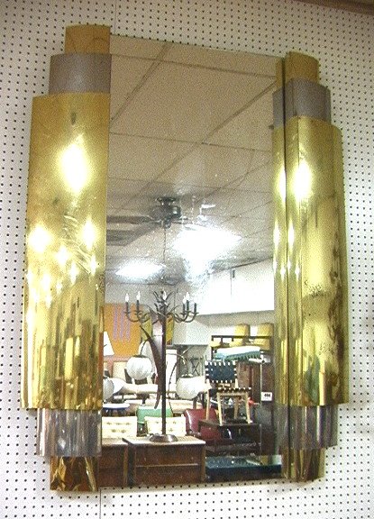 C JERE Style Brass & Metal Wall Mirror. Curved La: C JERE Style Brass & Metal Wall Mirror. Curved Layered Metal Sides. Not marked.-- Dimensions: H: 55 inches: W: 42 inches ---