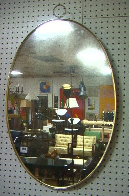 TURNER Wall Mirror. Brass finish oval frame with: TURNER Wall Mirror. Brass finish oval frame with ring top. Marked.-- Dimensions: H: 32 inches: W: 20 inches ---