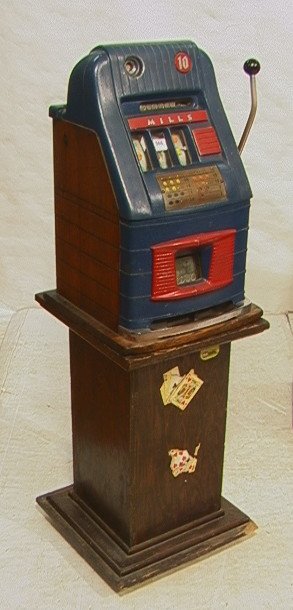Antique MILLS 10 cents Dime Slot Machine. Heavy m: Antique MILLS 10 cents Dime Slot Machine. Heavy metal slot machine with oak panel sides. On square oak pedestal base with casters.-- Dimensions: H: 55 inches: W: 16.5 inches: D: 18 inches ---
