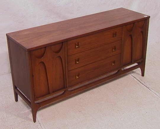 BRASILIA by BROYHILL American Modern Sideboard Cr: BRASILIA by BROYHILL American Modern Sideboard Credenza. Three drawers, two doors. Marked.-- Dimensions: H: 28 inches: D: 17 inches: L: 56 inches ---