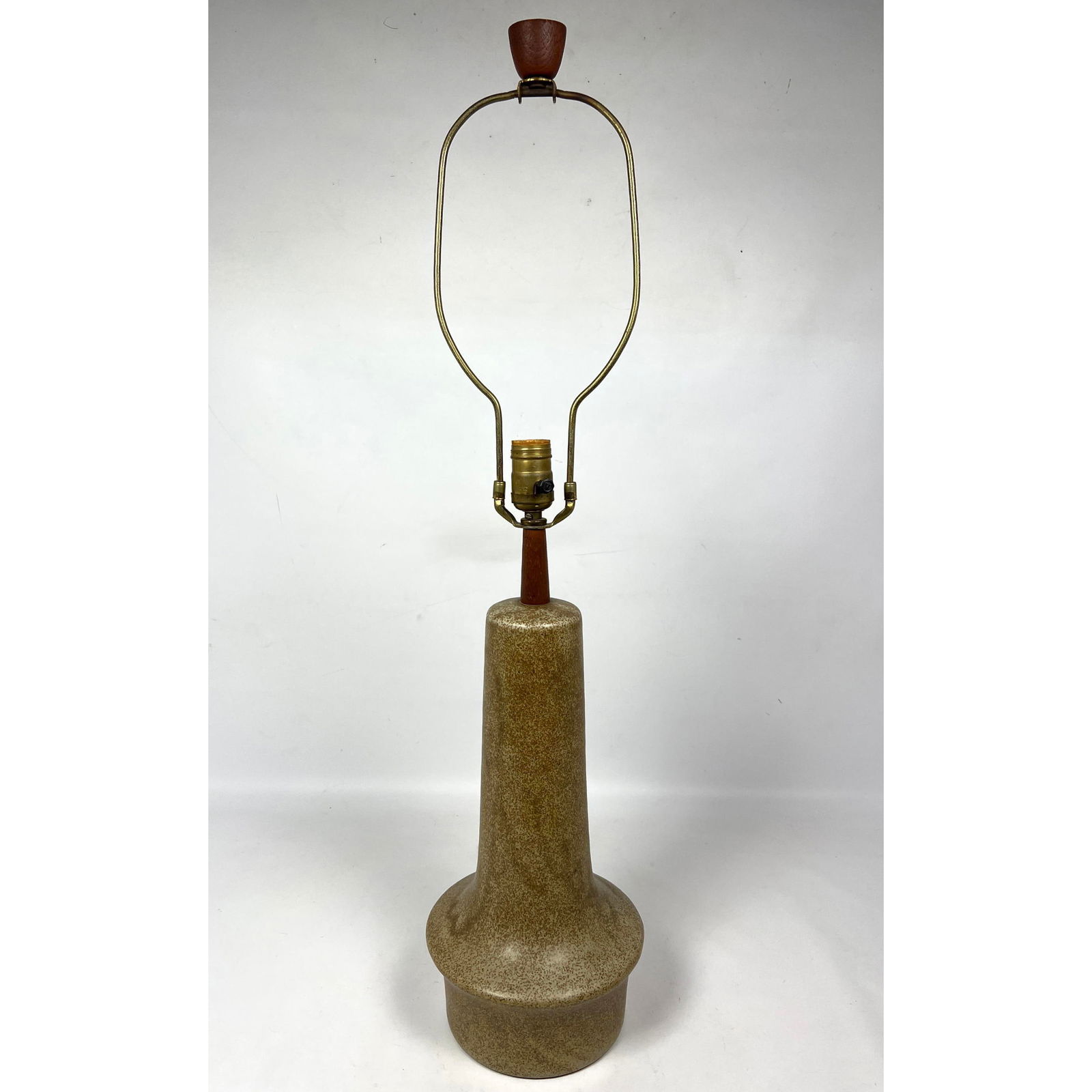 MARTZ by MARSHALL STUDIOS Art Pottery Table Lamp. Long Necked Form with mottled speckled oatmeal gla: MARTZ by MARSHALL STUDIOS Art Pottery Table Lamp. Long Necked Form with mottled speckled oatmeal glaze. Walnut trim and original walnut finial. Partial paper label. Dimensions: Height: 32.25 inches, W