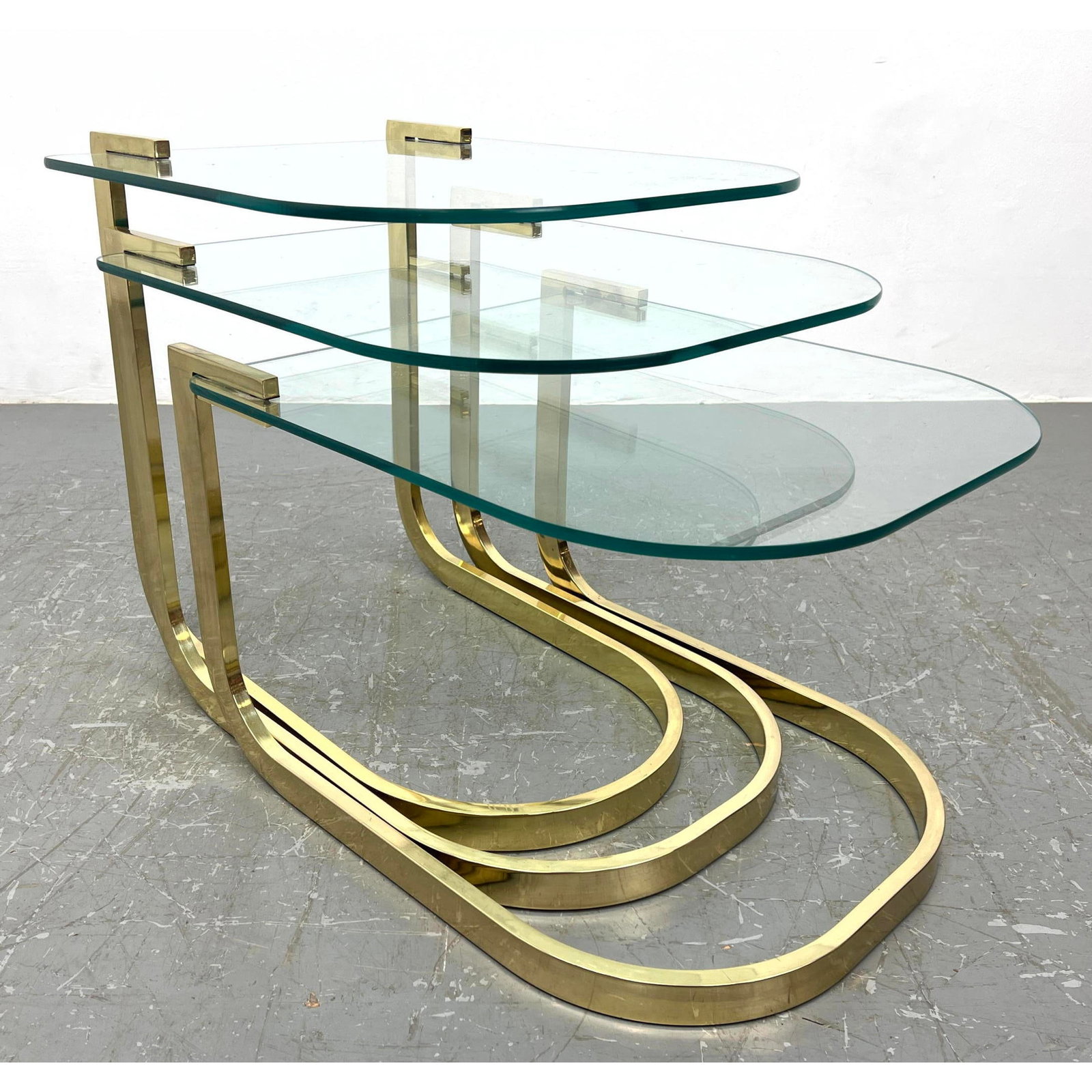3pc DIA Design Institute of America Gold Metal and Glass Nesting Tables.: 3pc DIA Design Institute of America Gold Metal and Glass Nesting Tables. Dimensions: Height: 21.5 inches, Width: 20 inches, Depth: 24 inches. ---